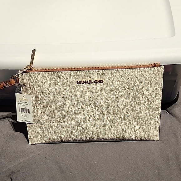 Michael Kors Cream Wristlet with Gold Accents - Picture 1 of 16